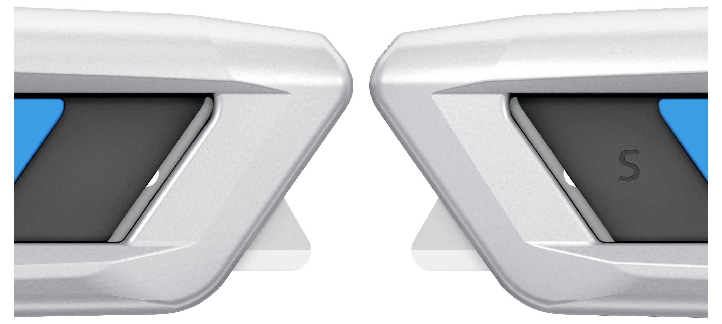 Srebrne części samochodowe z niebieskim i czarnym akcentem oraz literą 'S' po prawej stronie, prawdopodobnie logo lub emblemat.