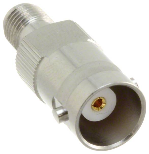 Srebrny konektor kablowy typu coaxial z gwintem na końcu i cylindrycznym otworem, używany do podłączania kabli w urządzeniach elektronicznych.