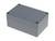 Szare, prostokątne obudowa z czterema śrubami w narożnikach. Prawdopodobnie służy jako osłona dla elementów elektronicznych.