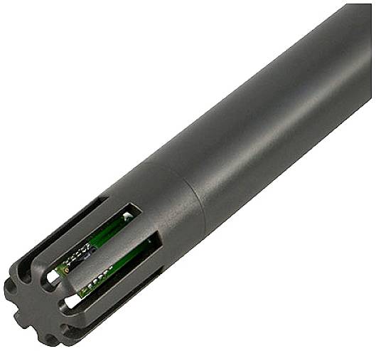 Długi, cylindryczny przyrząd metalowy z otwartymi lamelkami na jednym końcu, ukazujący elektroniczne komponenty wewnątrz.