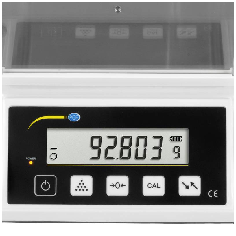 Cyfrowa waga wskazuje wagę 92,803 gramów. Wyświetlacz posiada przyciski do włączania/wyłączania, kalibracji i ustawień podstawowych.