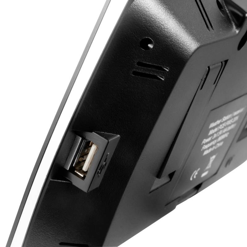 Czarne urządzenie z gniazdem USB, widok z boku. Szczegóły techniczne, bez rozpoznawalnych marek lub nazw.