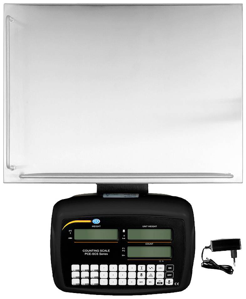 Cyfrowa waga licząca z wyświetlaczem i klawiaturą. Obok po lewej stronie znajduje się zasilacz do ładowania lub zasilania.