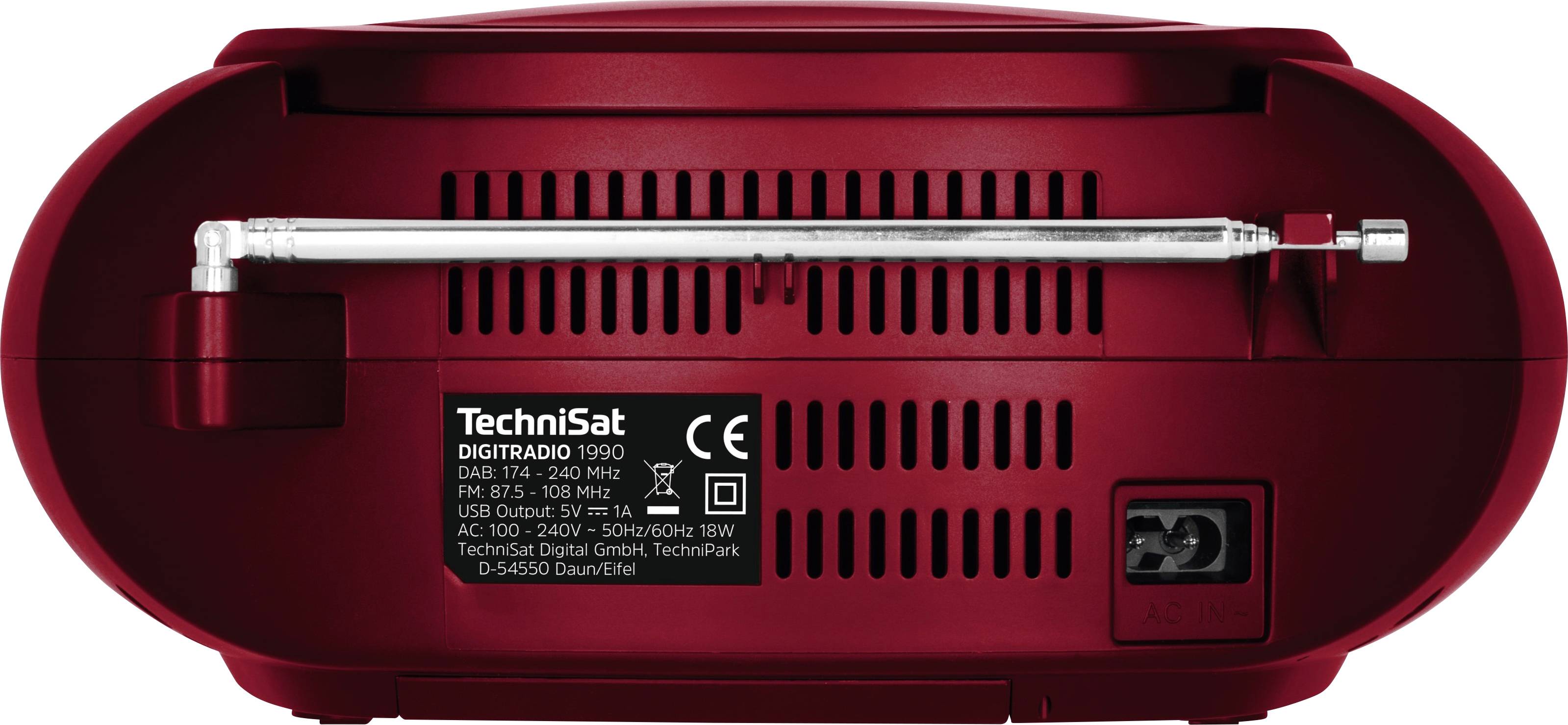 Widok z tyłu czerwonego radia z wysuwaną anteną, wejściem oraz informacjami o producencie na etykiecie.