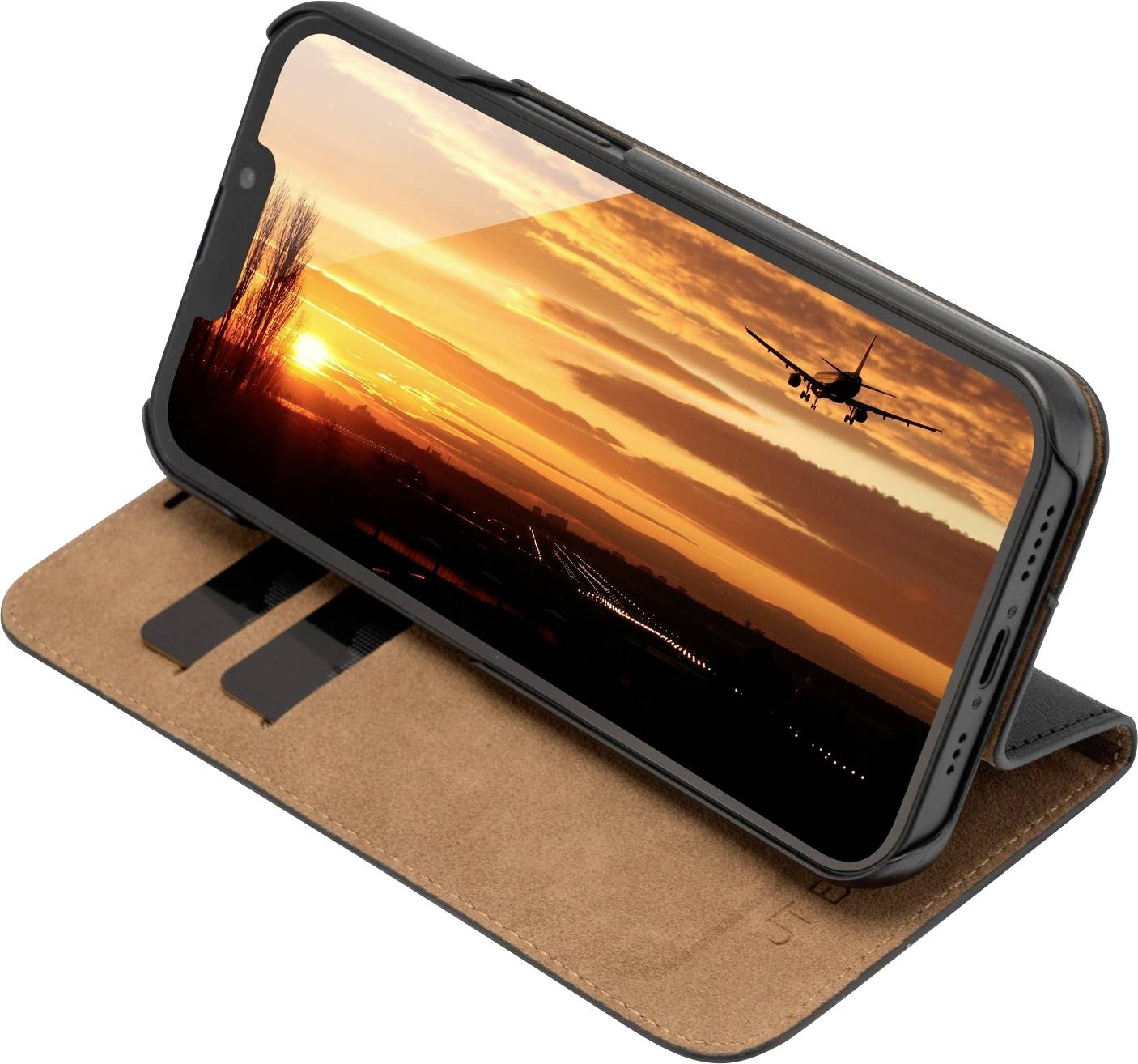 Smartfon w brązowym etui, wyświetlający zachód słońca z pasem startowym i samolotem podczas podchodzenia do lądowania.