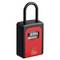 Czarno-czerwona kłódka numeryczna z czterocyfrową kombinacją od '0000' do '9999'. Odpowiednia do zabezpieczania cennych przedmiotów lub drzwi.