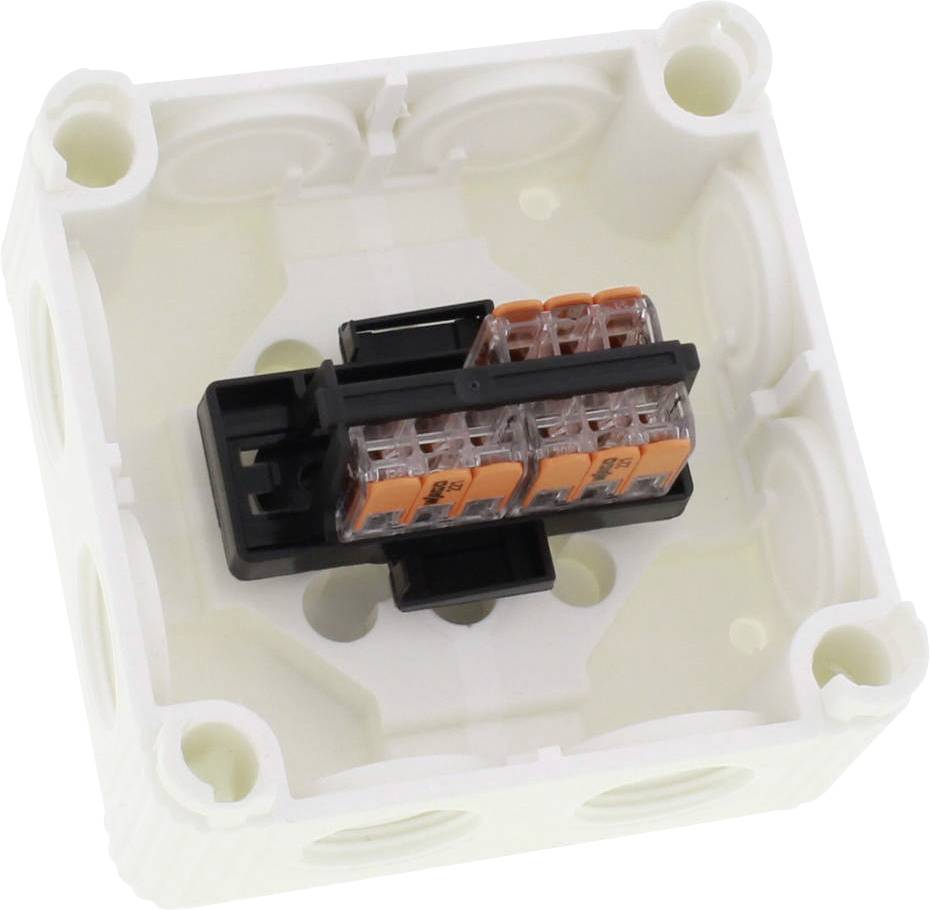 Pusta biała puszka rozgałęźna z widocznym blokiem zaciskowym pośrodku, umożliwiającym podłączenie przewodów.