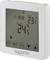 Cyfrowy termostat z wyświetlaczem: 'ZEGAR 10:58', 'USTAW 23,5°C', 'POKÓJ 24,5°C'. Przyciski do ustawień, symbole funkcji.