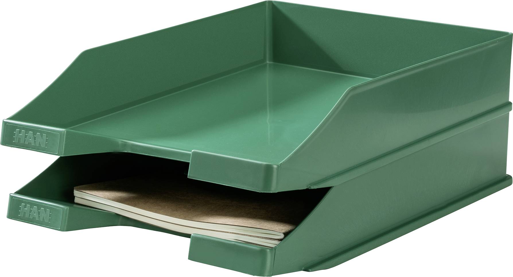 Dwie zielone plastikowe tacki, górna pusta, na dolnej leży notes.