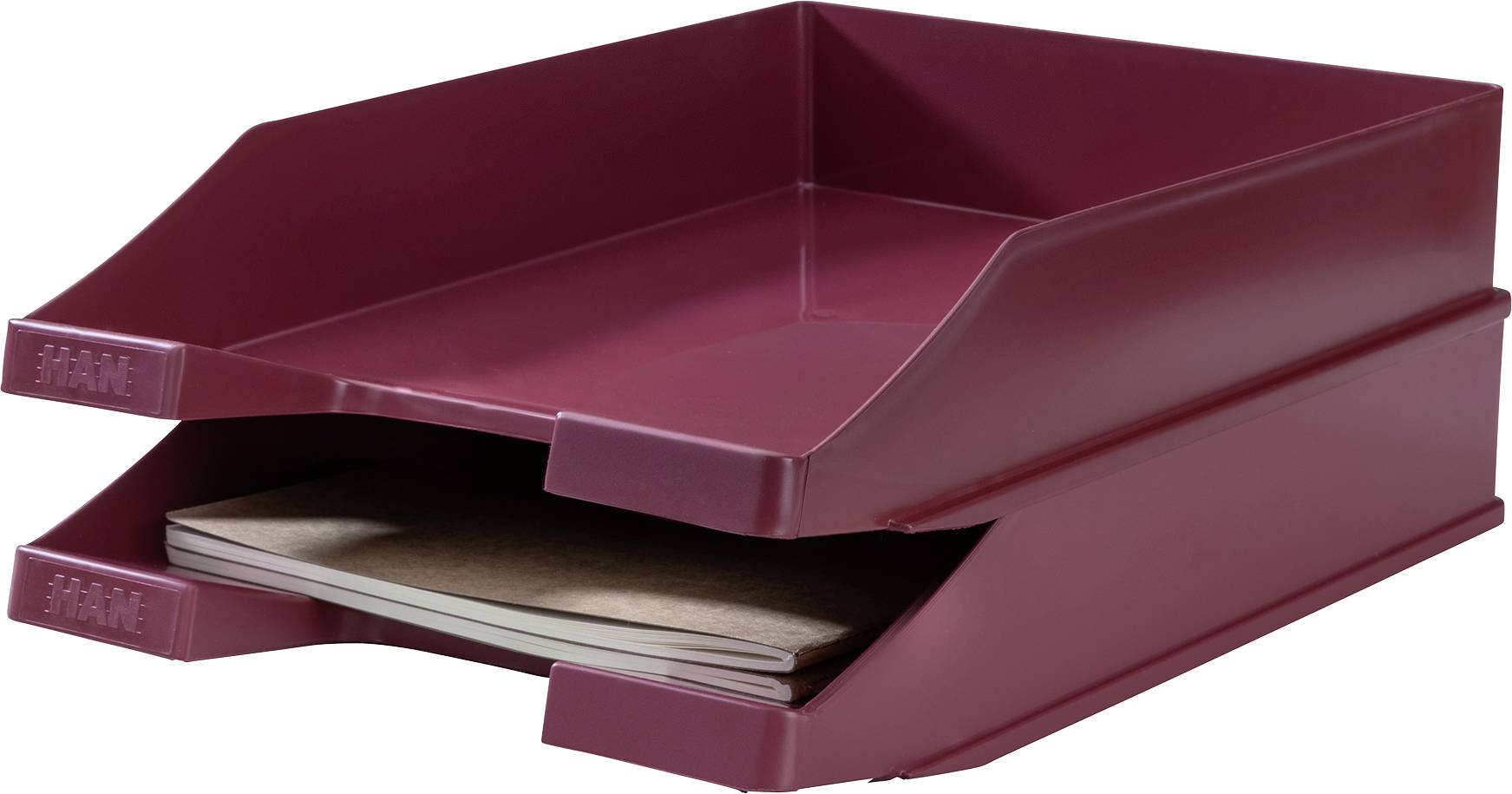 'Dwie czerwone teczki na dokumenty,ułożone jedna na drugiej, górna pusta, dolna wypełniona zeszytami.'