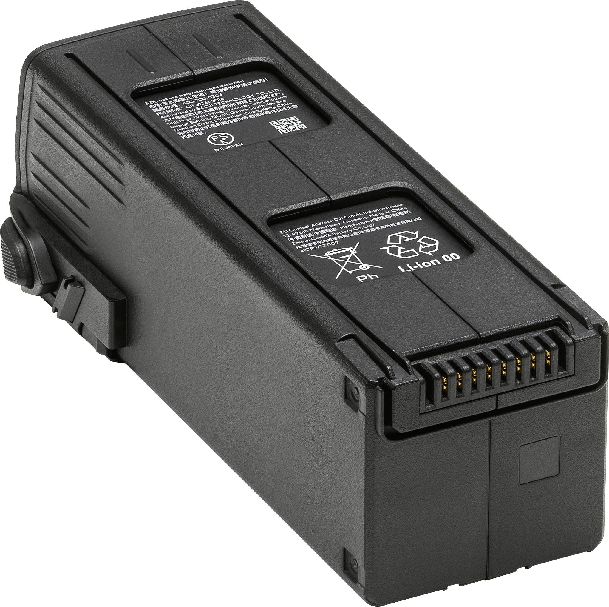 Czarna bateria z elektronicznymi stykami i oznaczonymi symbolami recyklingu oraz rodzaju baterii, otoczona kolorowym przewodem.