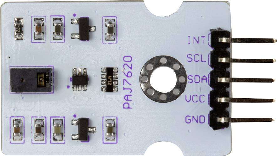 Płytka z sensorem PAJ7620 z pinami przyłączeniowymi i mikrochipem, stosowana do rozpoznawania gestów i wzorców ruchu w projektach elektronicznych.