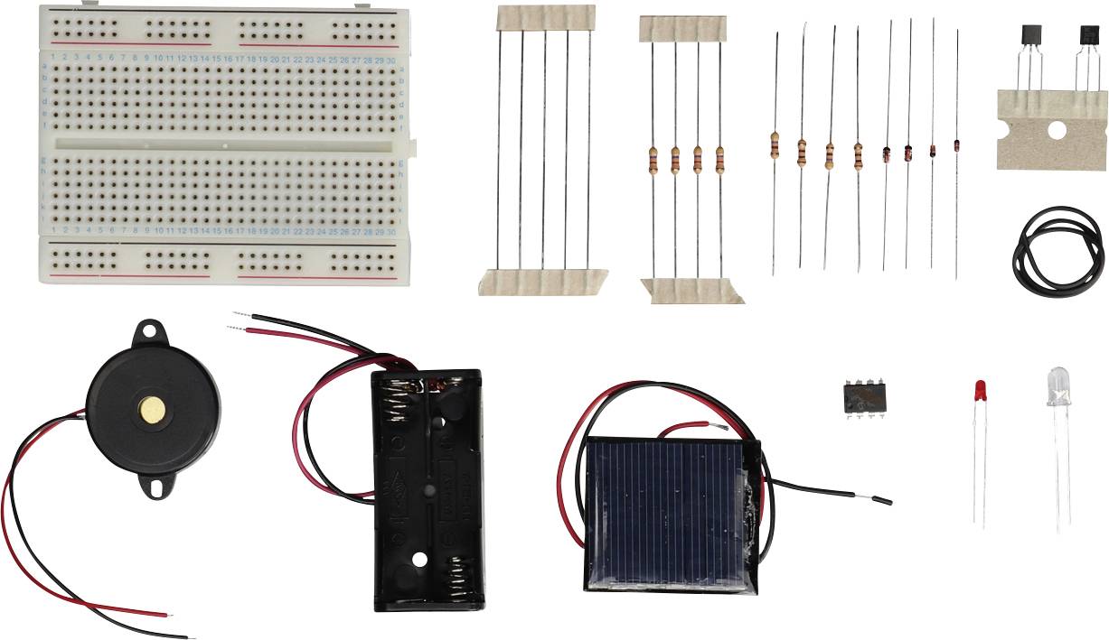Elementy elektroniczne do projektów majsterkowiczów: płytka stykowa, rezystory, diody LED, brzęczyk, obudowa baterii, panel słoneczny i przewód.