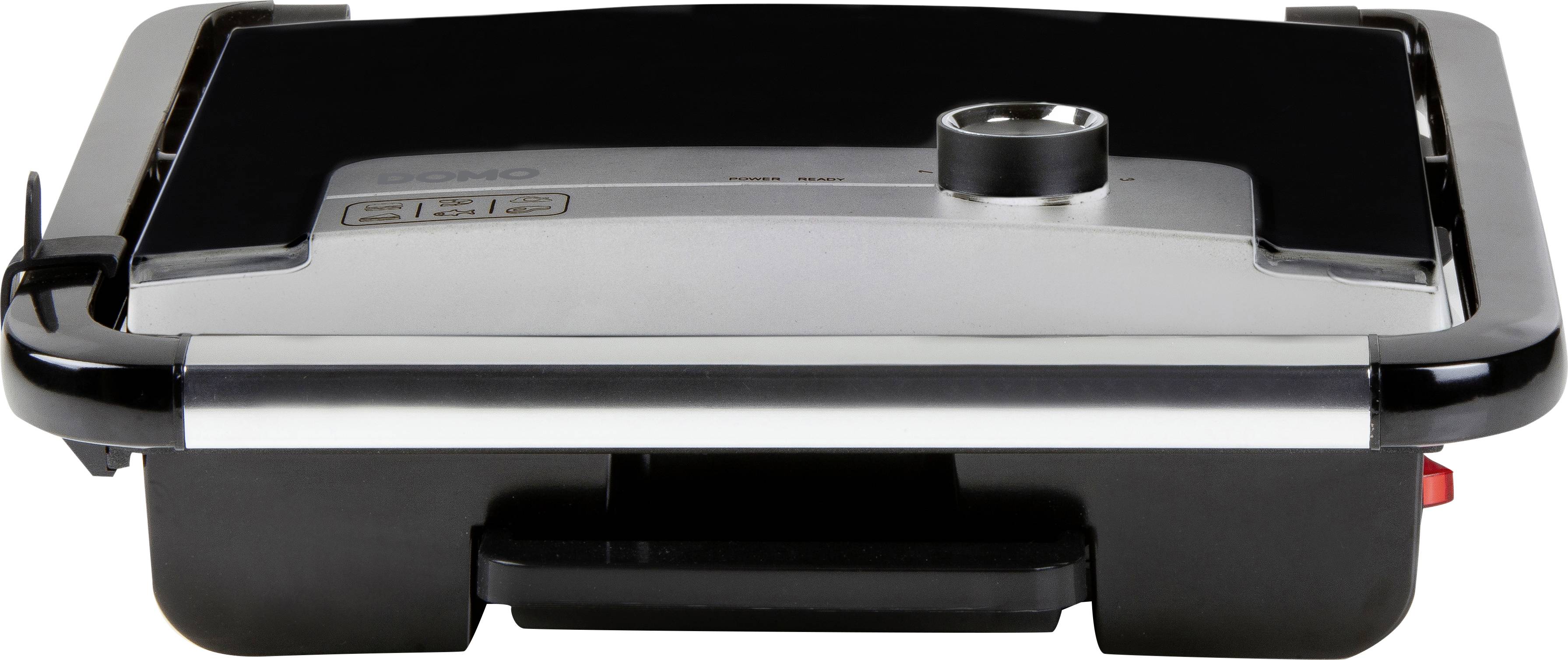 Czarny elektryczny grill z srebrną pokrywą, centralnym regulatorem temperatury i kontrolkami z boku. Idealny do grillowania w pomieszczeniach.