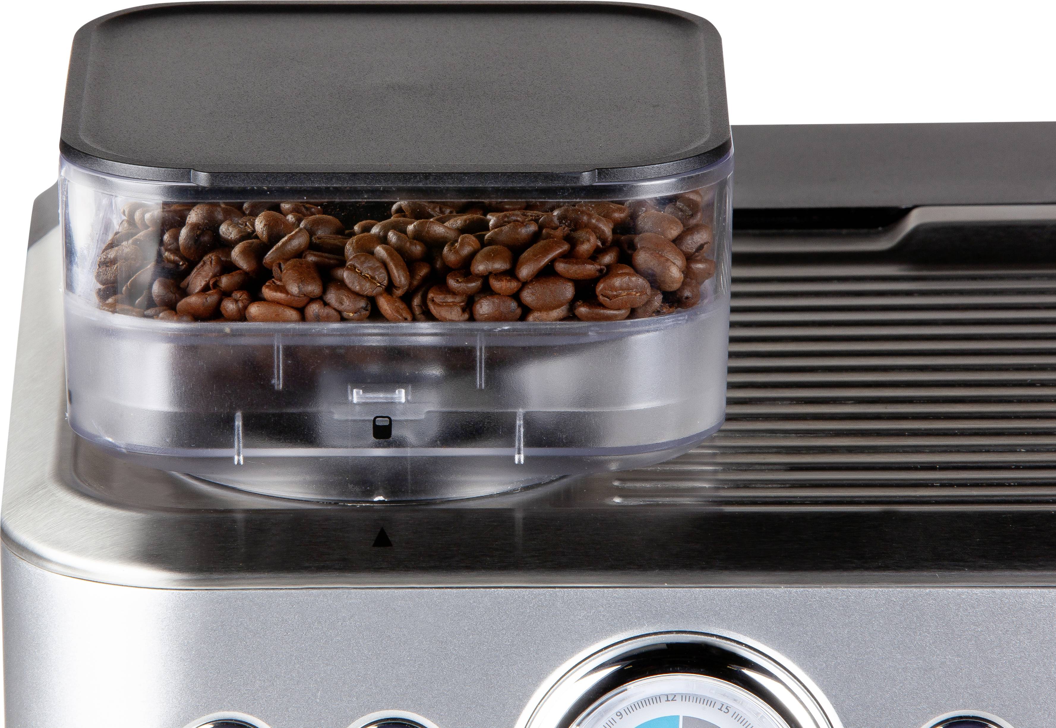 Przezroczyste naczynie ekspresu do kawy wypełnione ziarnami kawy. Poniżej widoczne są elementy sterujące urządzenia.