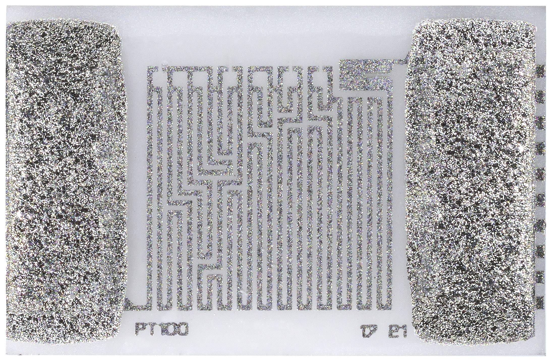 Srebrzysta powłoka przewodząca na urządzeniu Lab-on-a-Chip ukazuje złożony wzór obwodów elektronicznych między dwiema powierzchniami stykowymi.