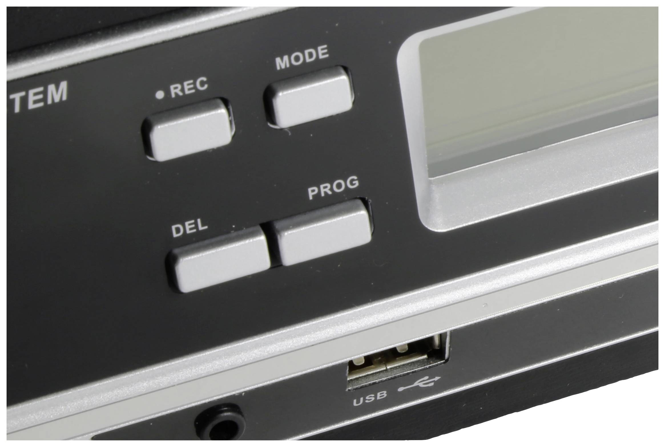 Zbliżenie urządzenia z czterema przyciskami: 'REC', 'MODE', 'DEL' oraz 'PROG'. Poniżej złącze USB. Po prawej stronie widoczny ekran.