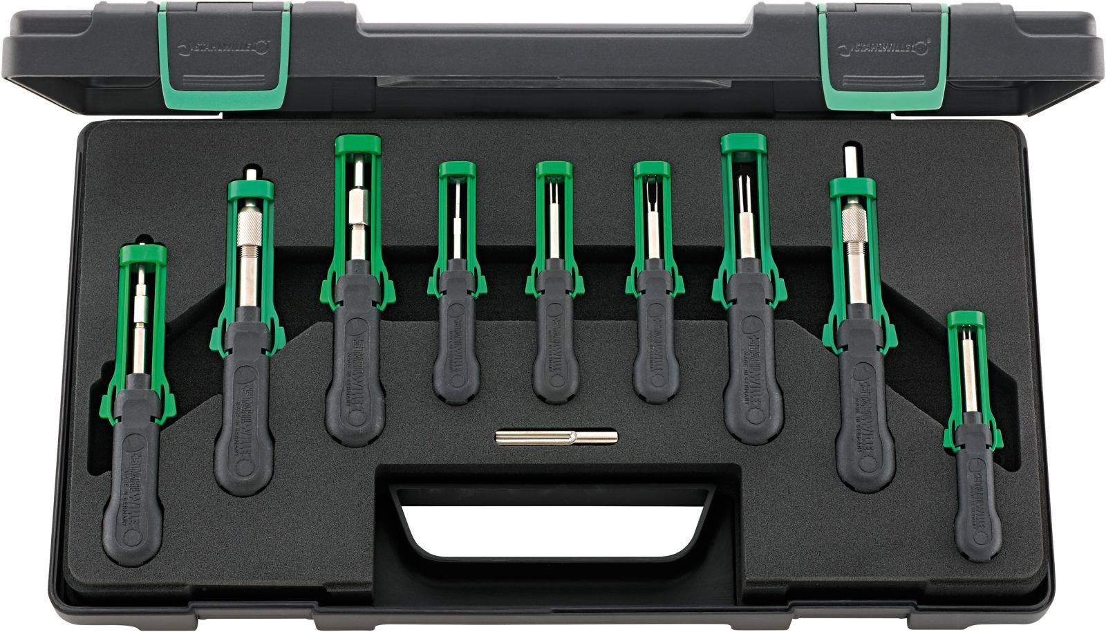 Zestaw dziewięciu zielonych wkrętaków w czarnej skrzynce narzędziowej. Każdy ma czarny uchwyt i metalową główkę.