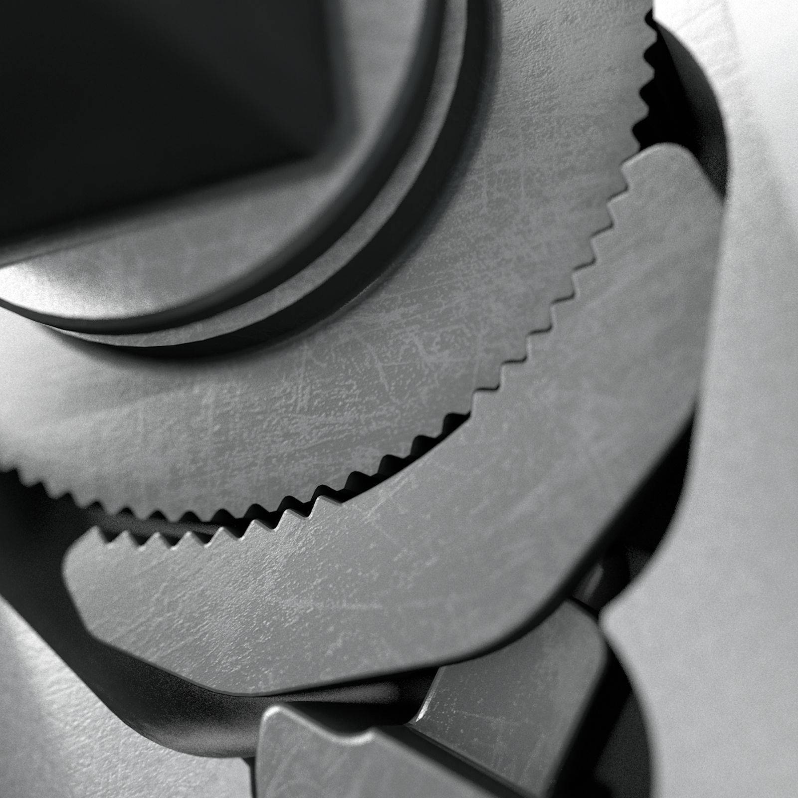 Zbliżenie współpracujących ze sobą metalowych kół zębatych, symbolizujących mechaniczną współpracę i ruch.