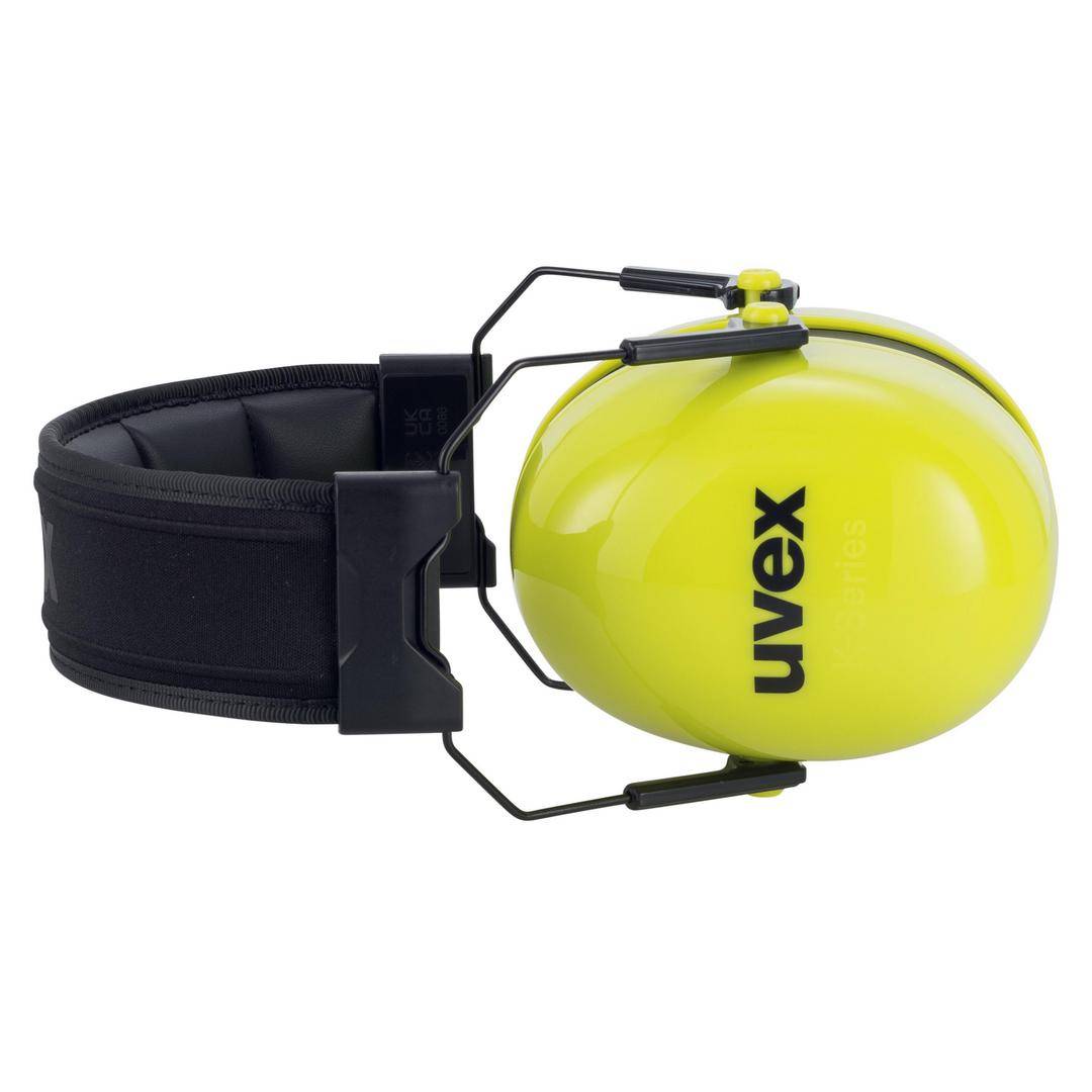 Żółte nauszniki ochronne marki 'uvex' z czarną opaską nagłowną, ułożone na jednym boku. Chronią uszy przed hałasem.