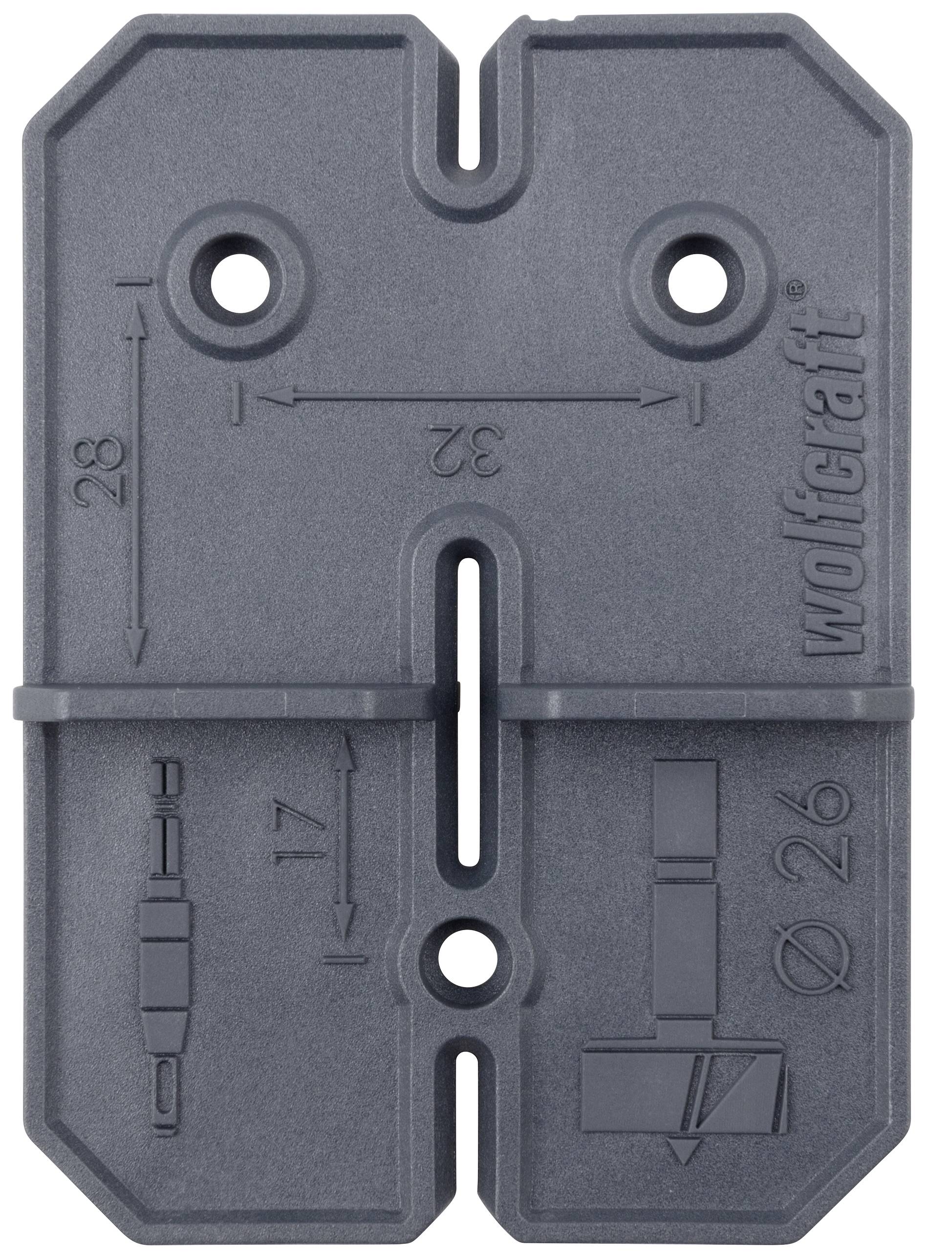 Szablon do wiercenia z prostymi symbolami i jednostkami miary w milimetrach do precyzyjnego wiercenia. Po lewej stronie 'Ø 17', po prawej stronie 'Ø 26', pośrodku '32'.