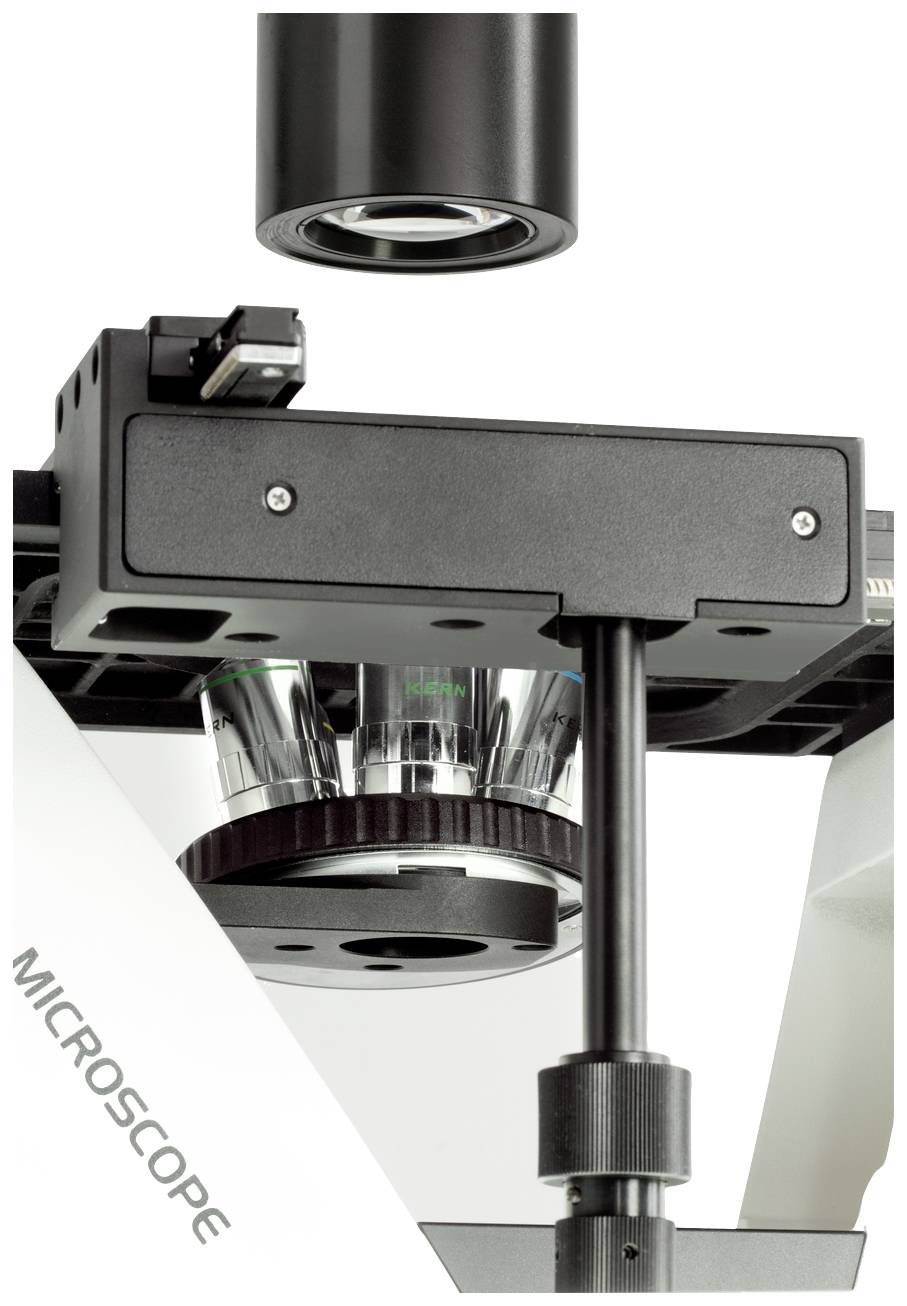 Zdjęcie makro rewolweru obiektywów i tubusu mikroskopu. Prezentuje szczegóły soczewek optycznych i elementów mechanicznych.