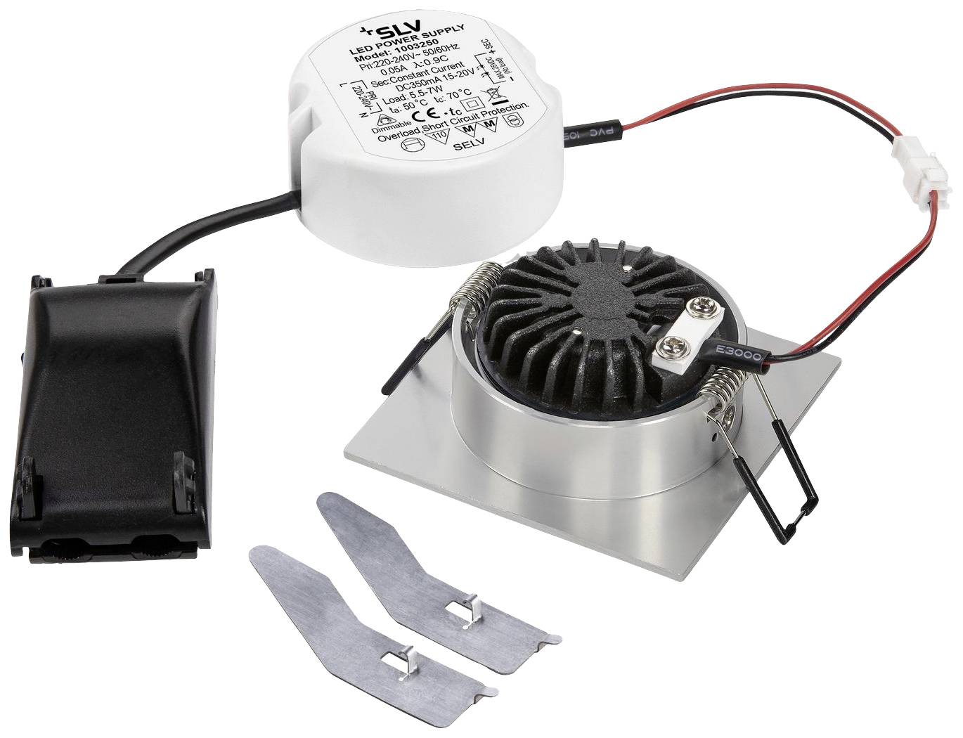 Sterownik LED z towarzyszącym mu elementem i dwoma metalowymi zaciskami. Sterownik posiada białą obudowę z informacjami technicznymi.