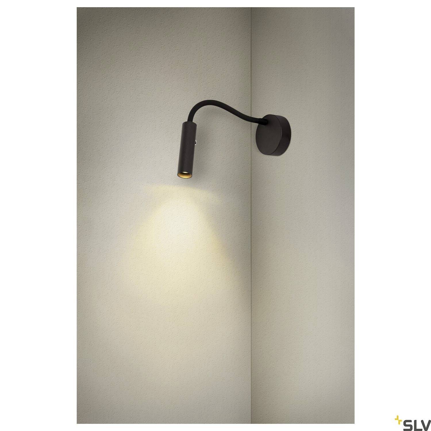 Lampa ścienna z elastycznym ramieniem i cylindryczną głowicą, rzucająca światło na ścianę, o nowoczesnym designie w kolorze czarnym.