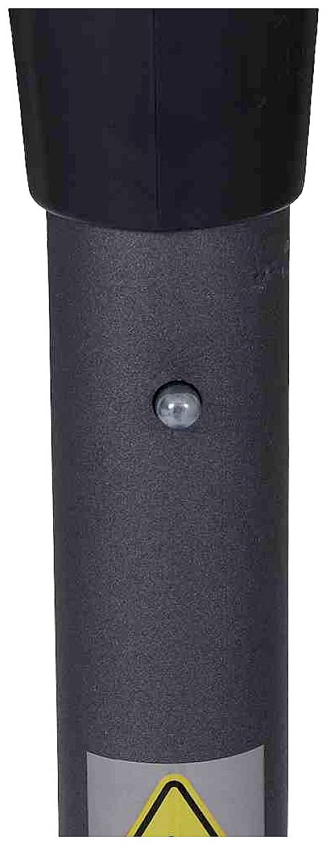 Czarny metalowy słup z małym, okrągłym czujnikiem pośrodku. Na dole wyraźnie widoczny jest symbol ostrzegawczy.
