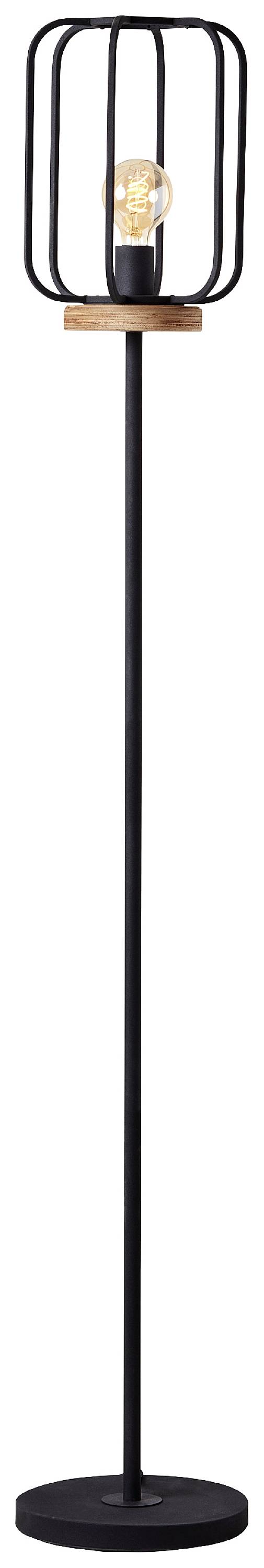 Czarna lampa stojąca z abażurem z metalowej siatki i widoczną żarówką, osadzona na okrągłej podstawie, o nowoczesnym i minimalistycznym designie.