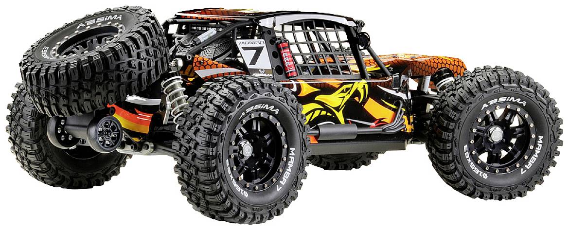 Zdalnie sterowany samochód o dużym prześwicie i oponach z grubym bieżnikiem, ozdobiony wzorem smoka w kolorach pomarańczowo-czarnych.