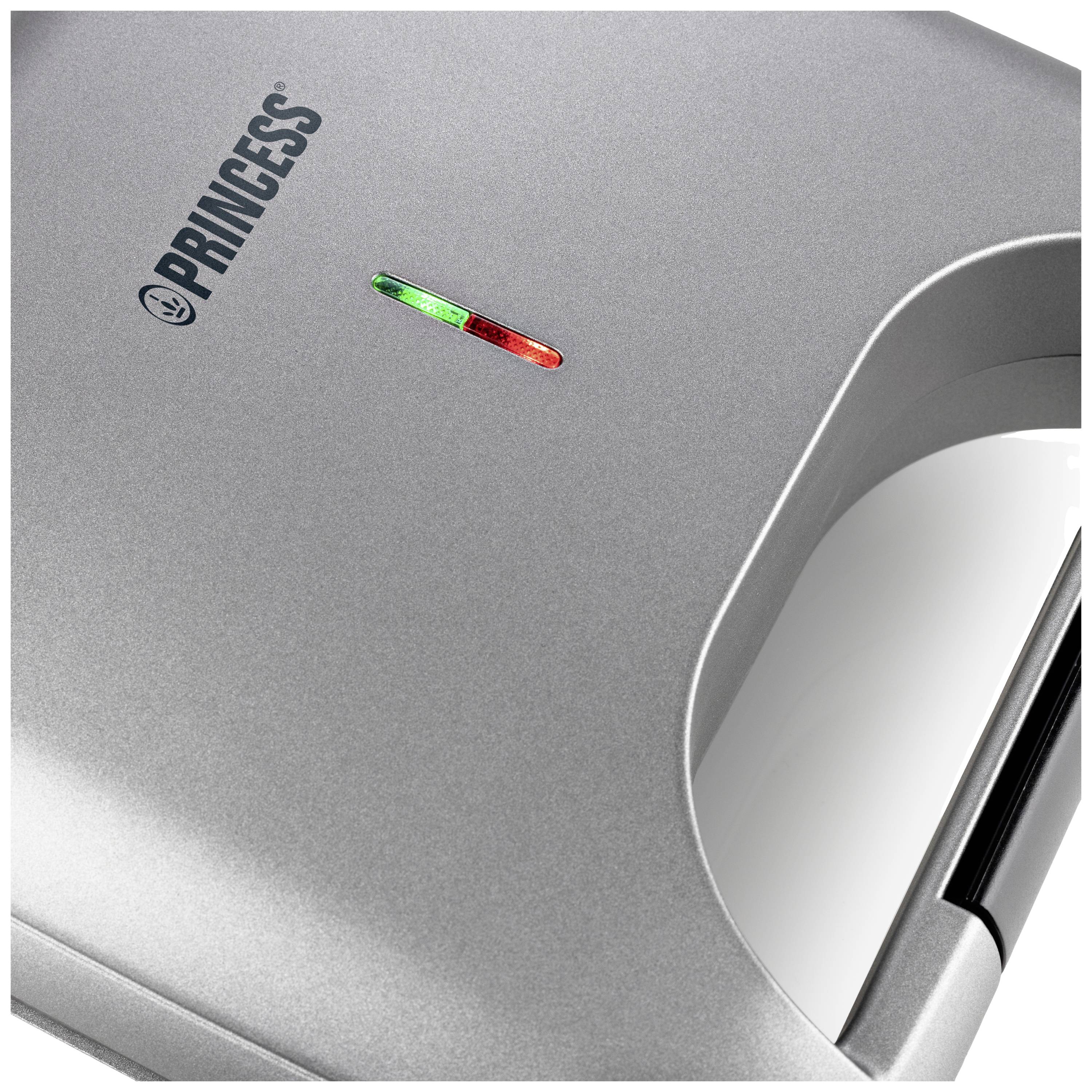 Żelazko do gofrów widziane z góry z czerwonym i zielonym podświetleniem na pokrywie urządzenia, marka 'PRINCESS'.