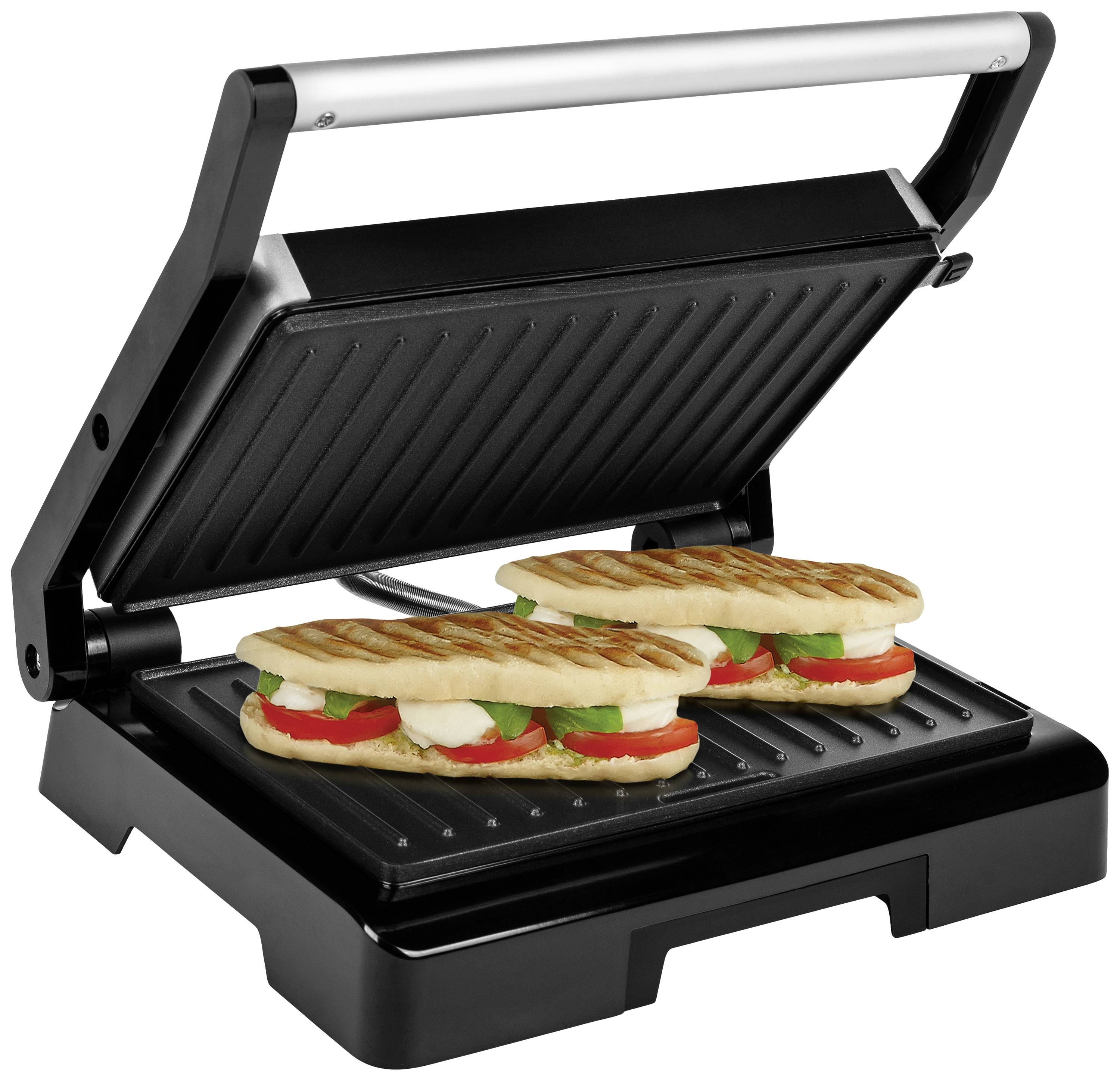 Grill kontaktowy z dwoma grilowanymi kanapkami zawierającymi pomidory, mozzarellę i bazylię. Grill jest częściowo otwarty.