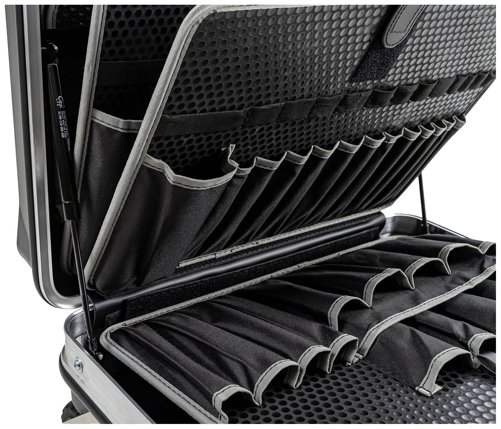 Otwarty kufer na narzędzia z wieloma elastycznymi uchwytami wewnątrz, przeznaczony do zorganizowanego przechowywania narzędzi.