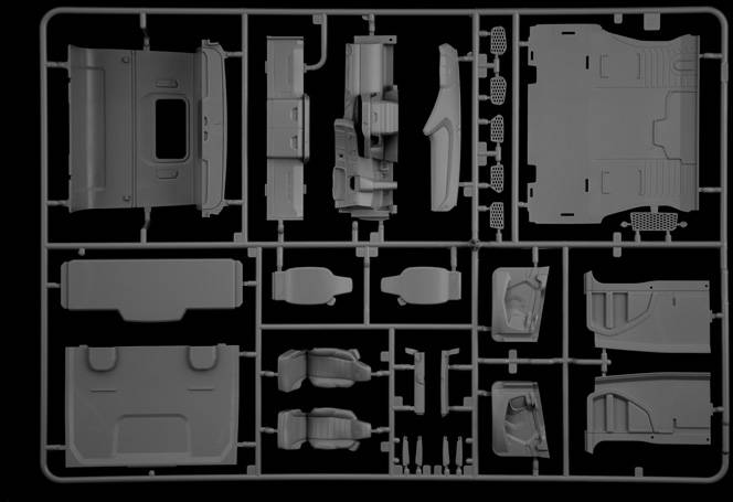 Czarna rama przytrzymuje liczne szczegółowe szare elementy modelu, które prawdopodobnie są przeznaczone dla pojazdu lub podobnej konstruowanej makiety.