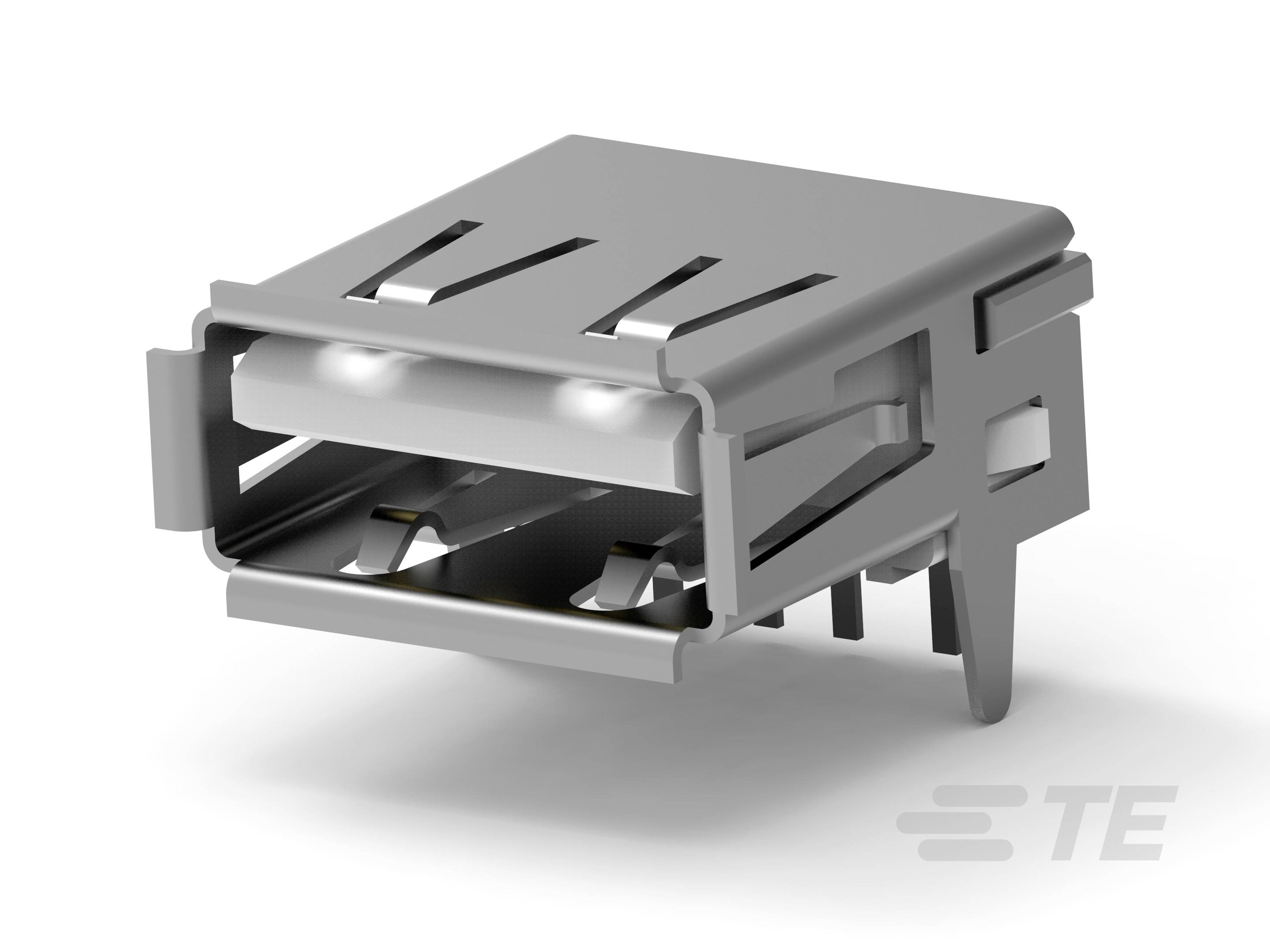 Zbliżenie złącza USB, ukazujące metalowe styki oraz prostokątny kształt z napisem 'TE' w prawym dolnym rogu.