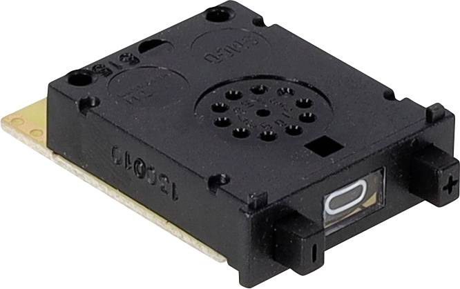 Czarny element elektroniczny, przypominający mały głośnik lub czujnik, zamontowany na prostokątnej płytce drukowanej.