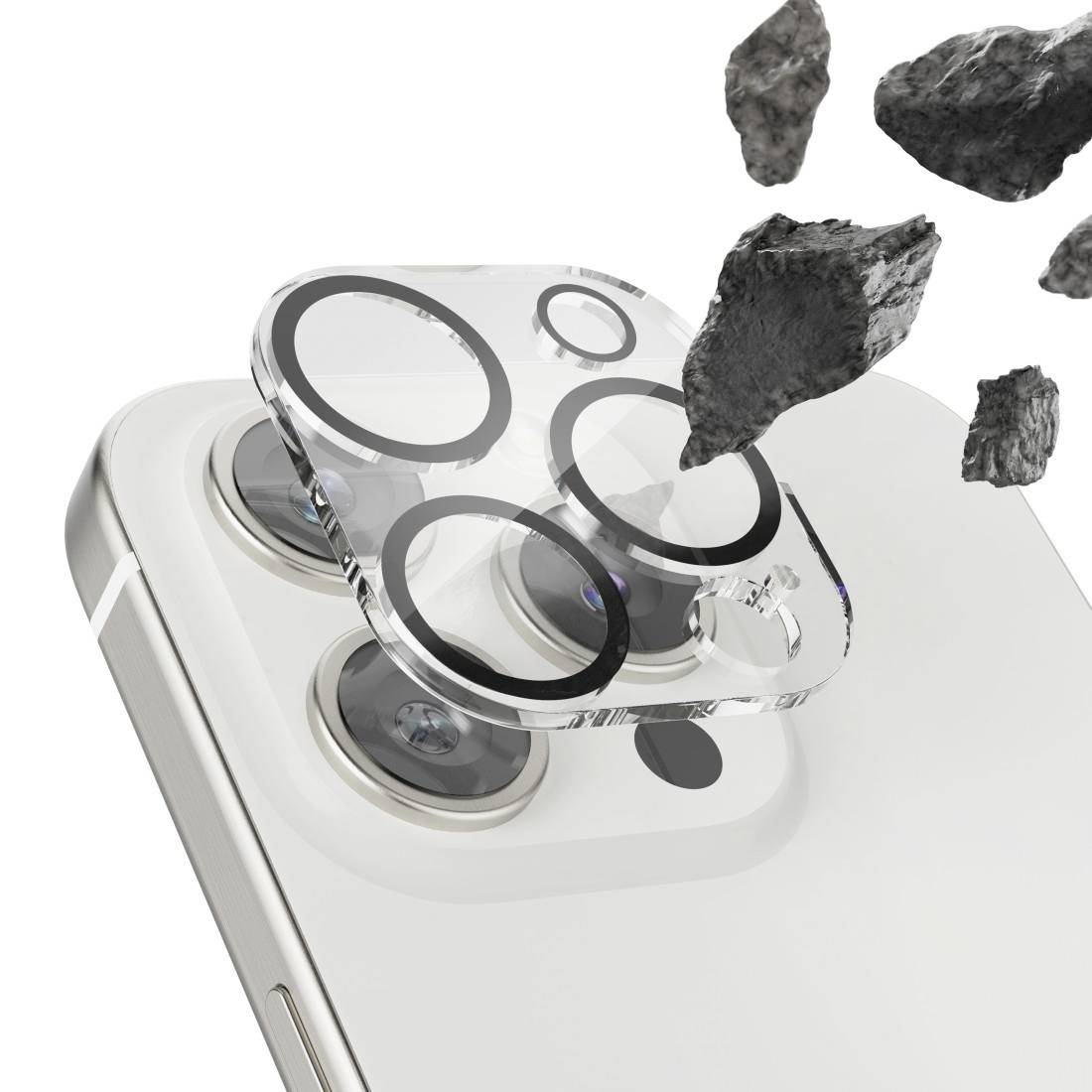 Biała tylna strona telefonu z wypukłą, szklaną osłoną obiektywu kamery, otoczona unoszącymi się ciemnymi kamieniami.