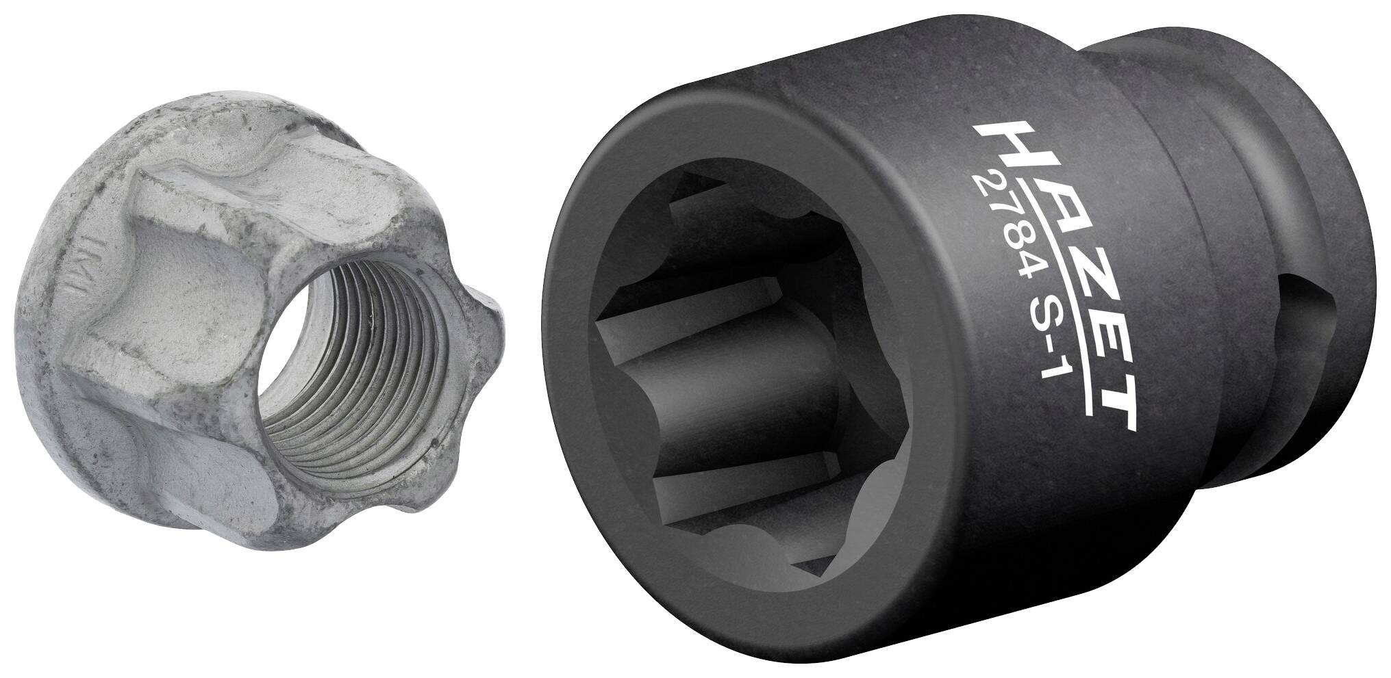 Nasadka HAZET 2174 S-1 obok metalowej nakrętki. Nasadka posiada sześciokątny otwór do zamocowania nakrętki.