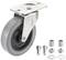 Szare kółko jezdne z płytą montażową, dwiema śrubami, dwiema tulejkami i nakrętkami do zamocowania na powierzchni.