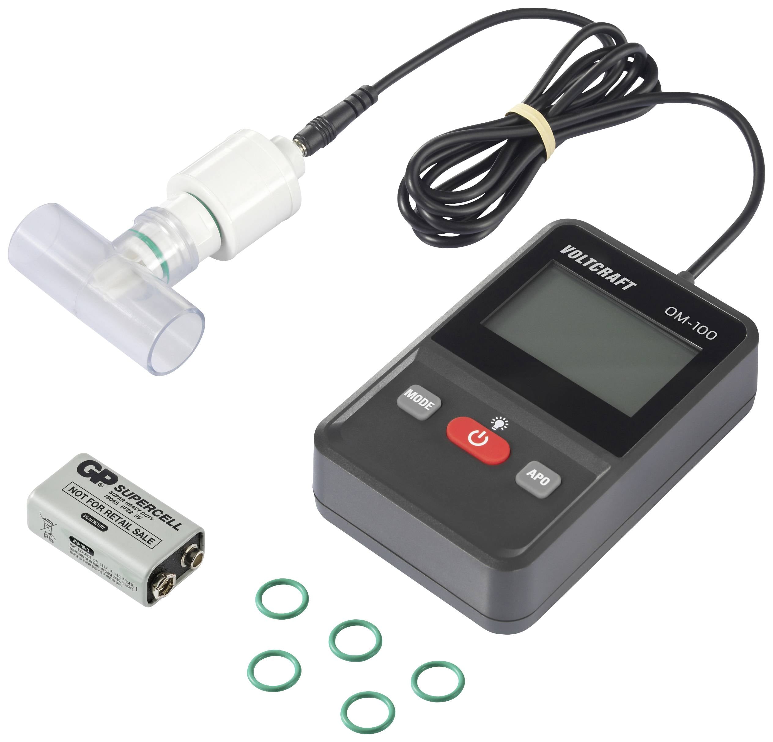 Urządzenie elektroniczne z wyświetlaczem i przyciskami, połączone z czujnikiem oddechu. Obok leży bateria i kilka zielonych uszczelek.