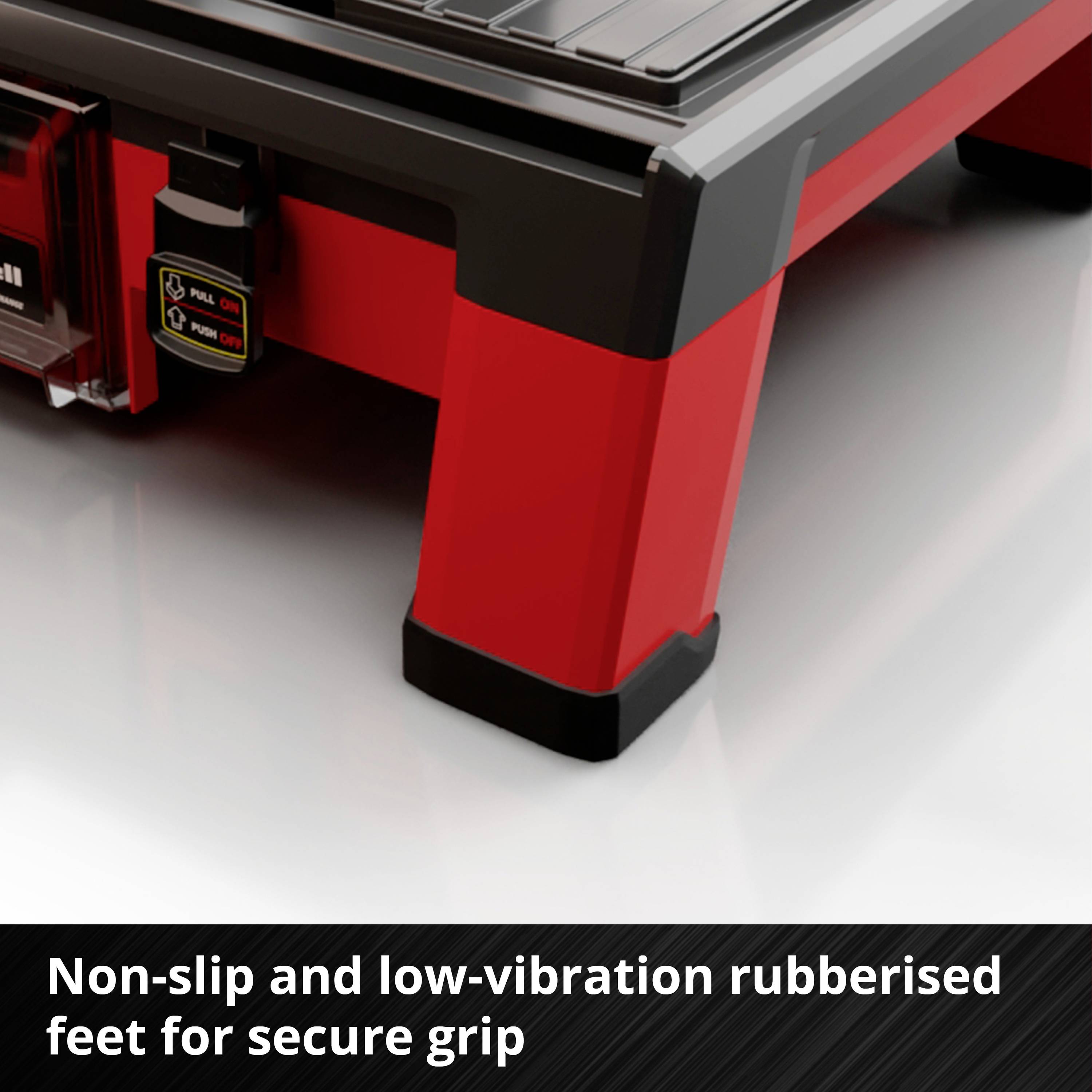 Czerwona maszyna z antypoślizgowymi gumowymi stopkami zapewniającymi stabilne mocowanie na gładkich powierzchniach.