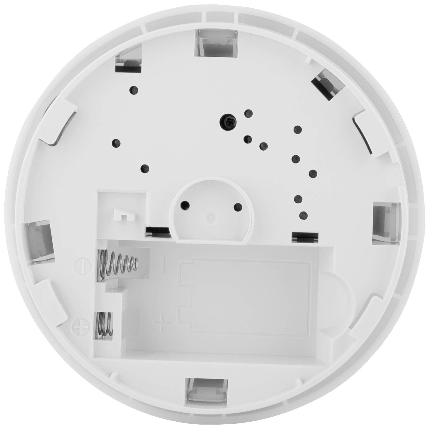 Widok z tyłu białego czujnika dymu z komorą baterii i otworami montażowymi, gotowy do zamocowania na suficie lub ścianie.