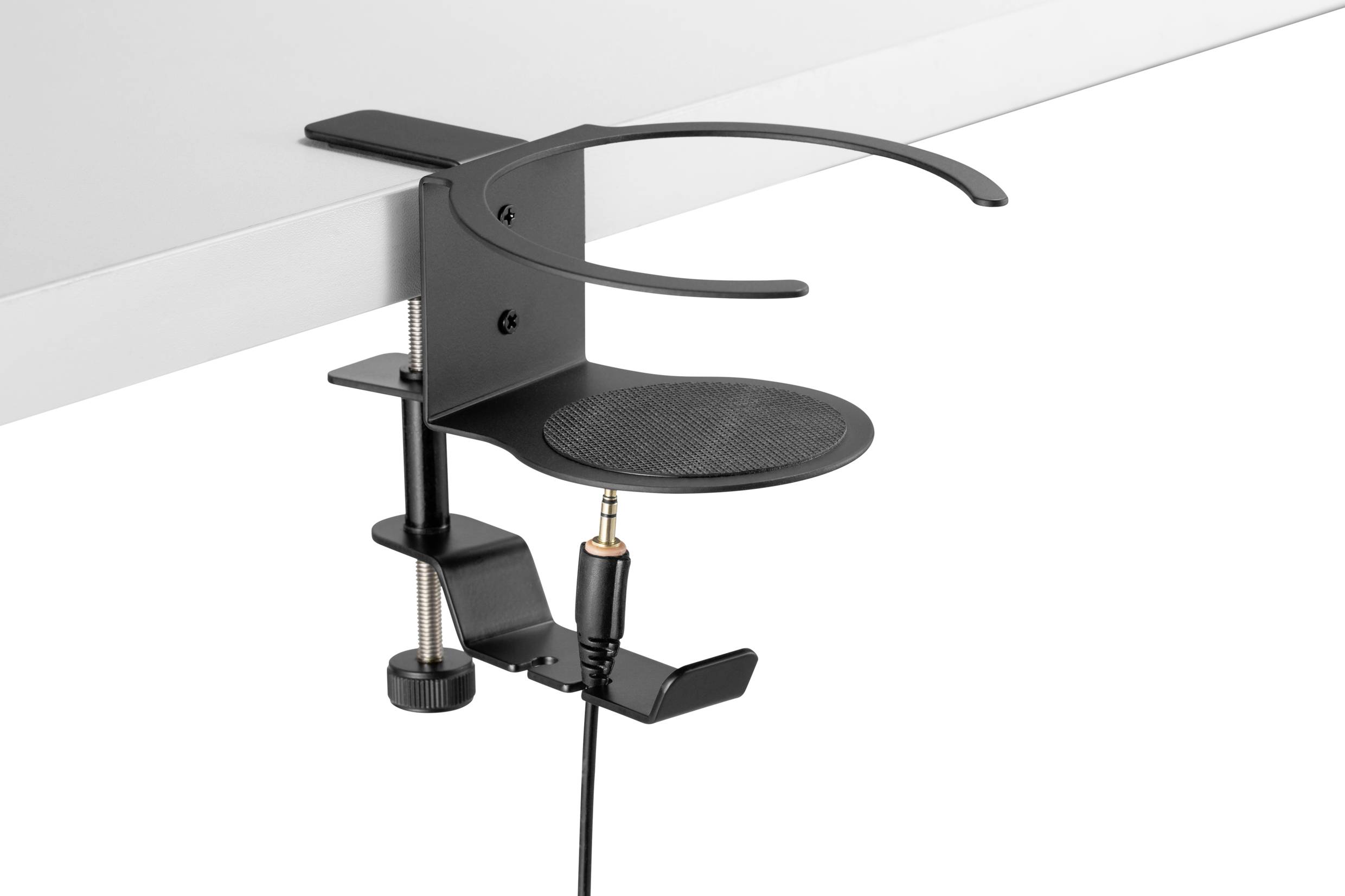 Czarny uchwyt na słuchawki zamocowany do stołu, z okrągłą podstawką i zaciskiem mocowanym na krawędzi blatu.