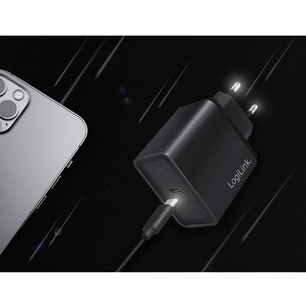 Smartfon i ładowarka na czarnym tle. Ładowarka jest podłączona do smartfona za pomocą kabla.