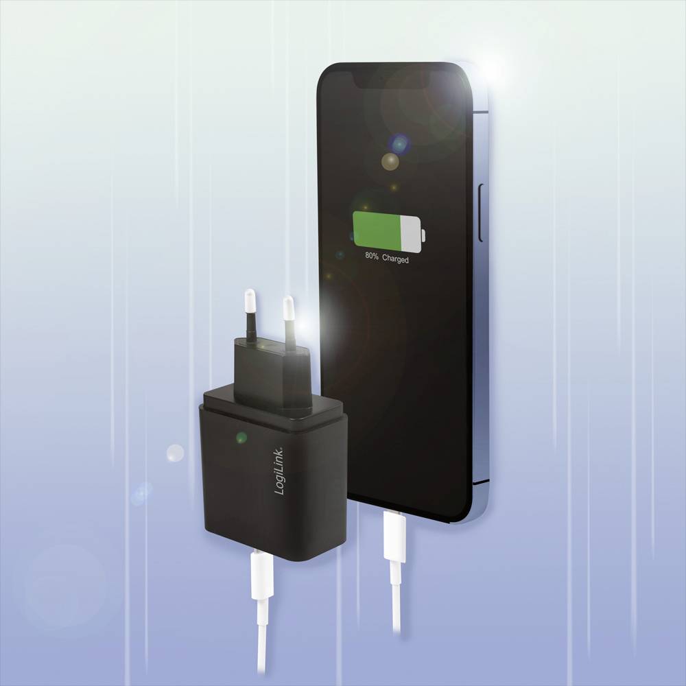 Smartfon jest ładowany i wyświetla wskaźnik poziomu baterii na 80%. Obok leży ładowarka z podłączonym kablem.