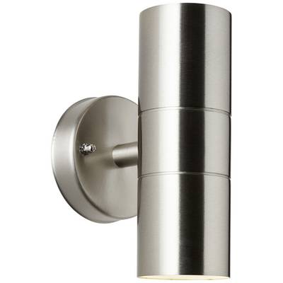 Srebrna, cylindryczna lampa ścienna z dwoma źródłami światła, zamontowana na okrągłej podstawie. Nowoczesny design, emitujący światło w górę i w dół.