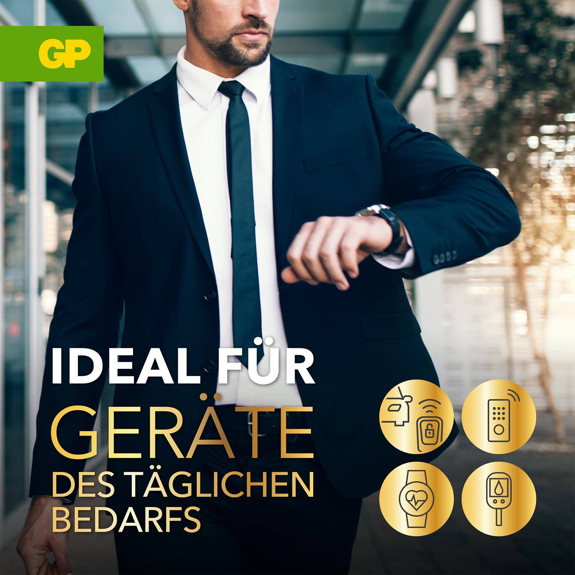 Mężczyzna w garniturze spogląda na zegarek. Tekst: 'Idealny do urządzeń codziennego użytku'. Symbole urządzeń na pierwszym planie.