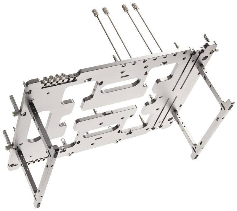 Metalowa podstawa montażowa do urządzenia elektronicznego, wyposażona w wiele punktów mocowania oraz wysuwane pręty. Przeznaczona głównie do modularnych adaptacji.