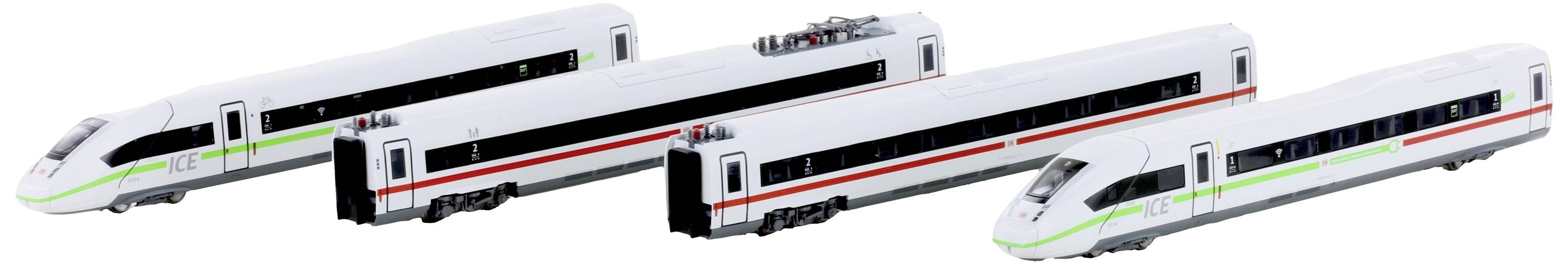 Cztery białe pociągi modelowe z zielonymi i czerwonymi pasami ustawione obok siebie. Reprezentują one pociągi dużych prędkości.